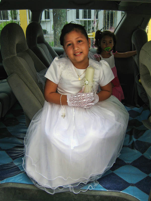 Daughter of Jorge the cab driver on her way to her first communion